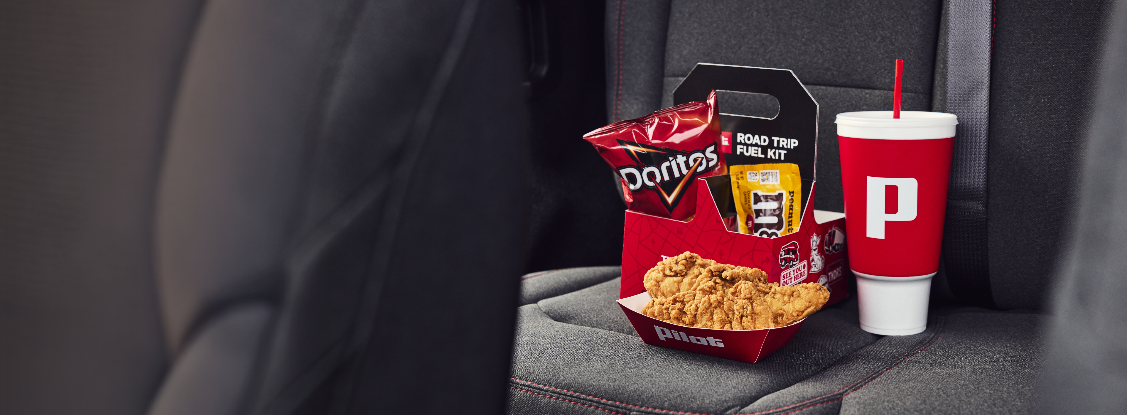 The $8 Road Trip Fuel Kit with chips, candy, a fountain drink, and 3 chicken tenders